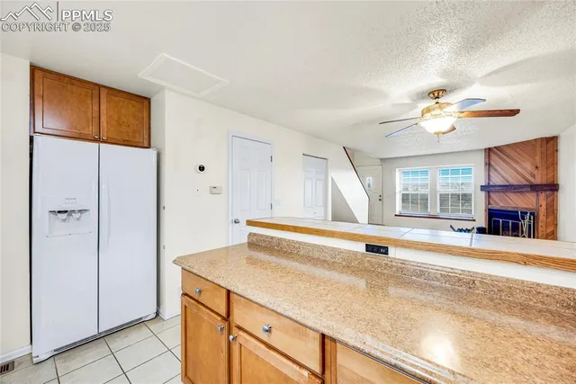 a kitchen with a sink appliances and cabinets