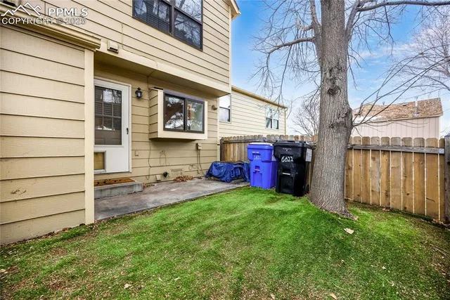 a view of a swimming pool with a patio and yard