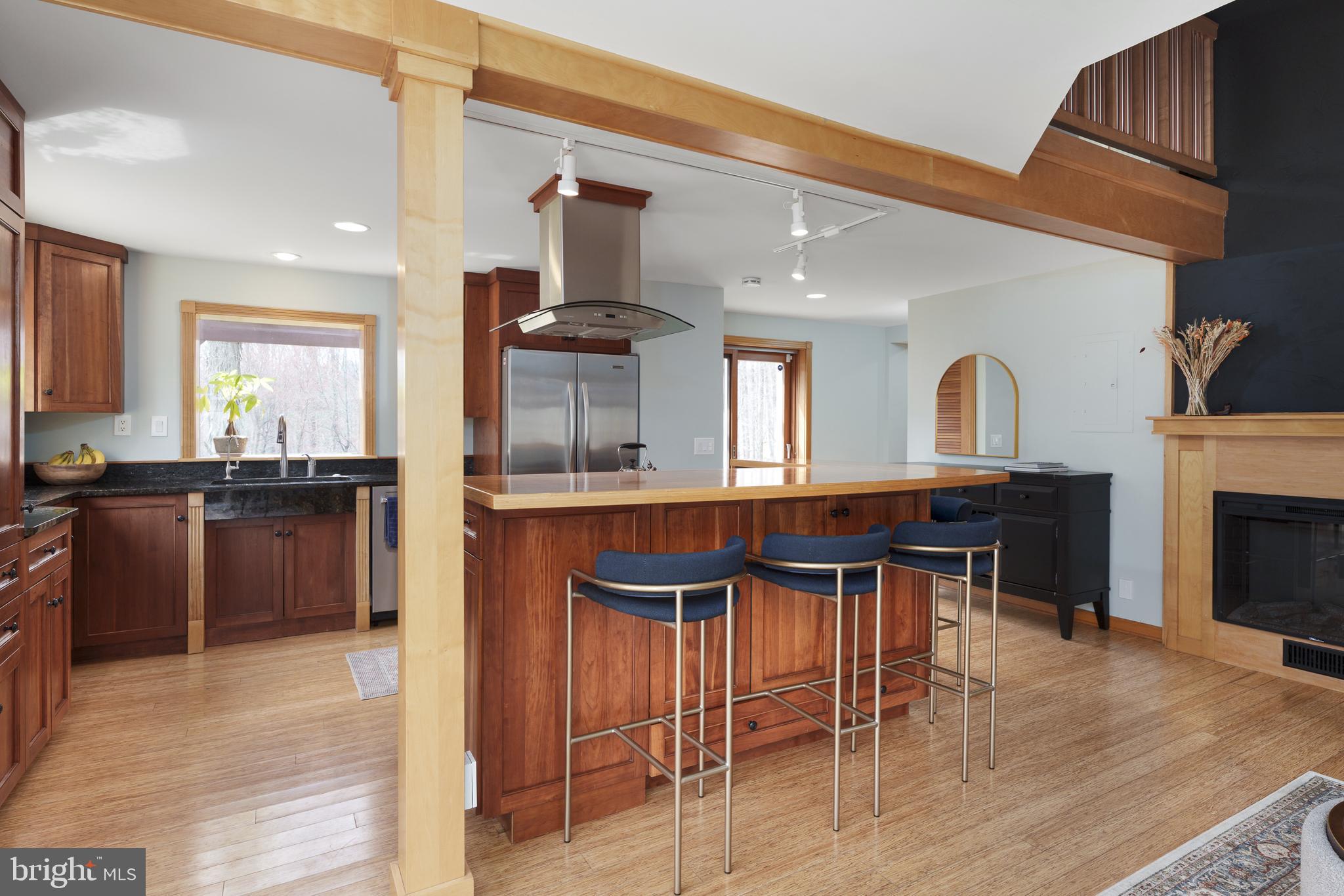 298 Hopewell Amwell Road Hopewell, NJ 08525 - Photo 23 of 51 a kitchen with kitchen island granite countertop a sink counter and chairs