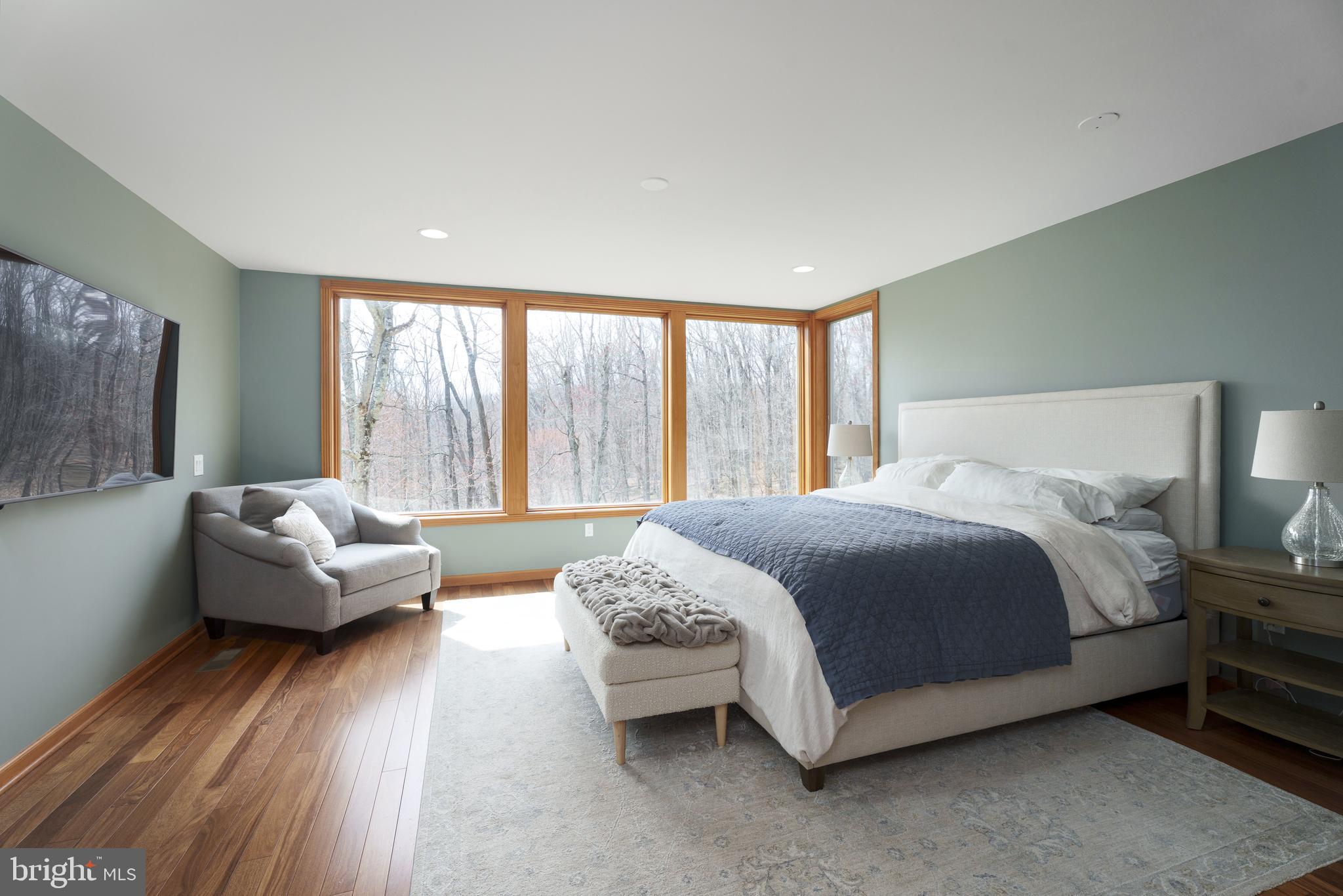 298 Hopewell Amwell Road Hopewell, NJ 08525 - Photo 27 of 51 a bedroom with a bed and a couch next to a window