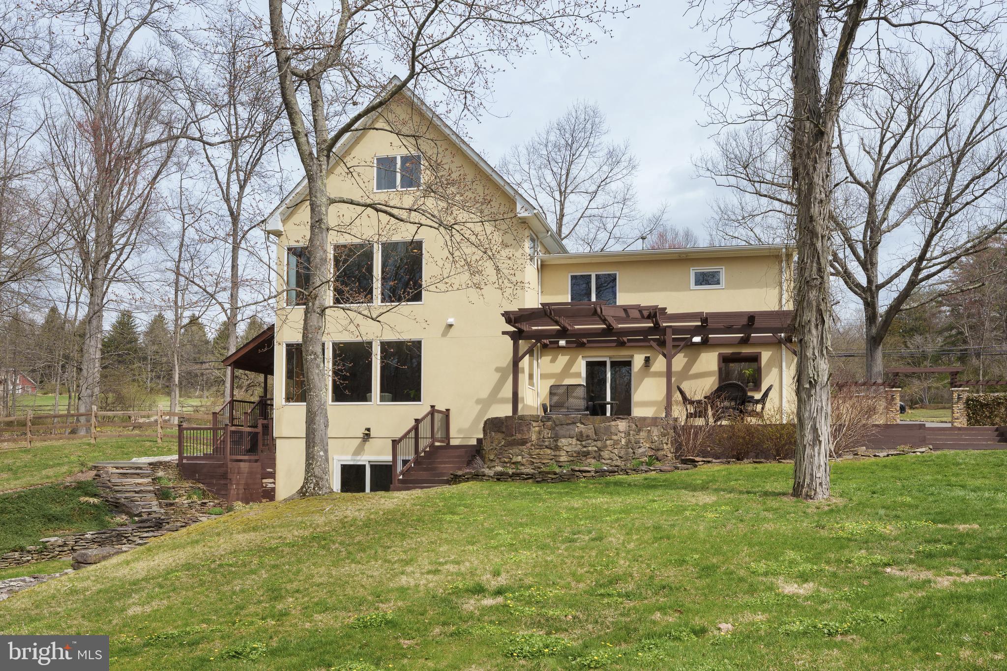 298 Hopewell Amwell Road Hopewell, NJ 08525 - Photo 40 of 51 a front view of a house with garden