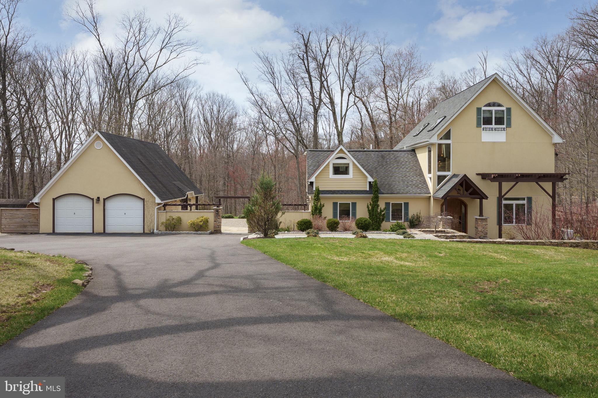 298 Hopewell Amwell Road Hopewell, NJ 08525 - Photo 51 of 51 a front view of a house with a garden and trees