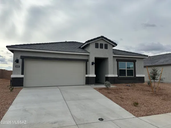 a front view of a house with yard