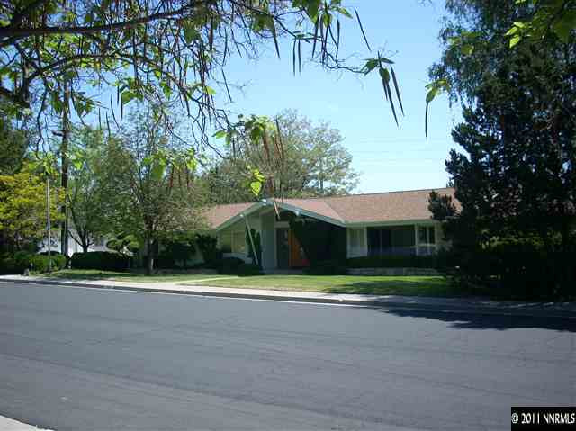 1990 Dant Boulevard Reno, NV 89509 - Photo 1 of 1 a front view of a house with a yard and trees