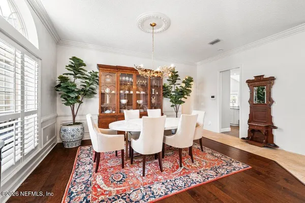 a view of a dining room with furniture window and outside view