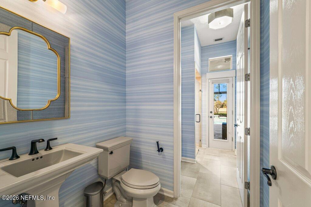 205 Royal Tern Road North Ponte Vedra Beach, FL 32082 - Photo 18 of 85 a bathroom with a toilet a sink and shower