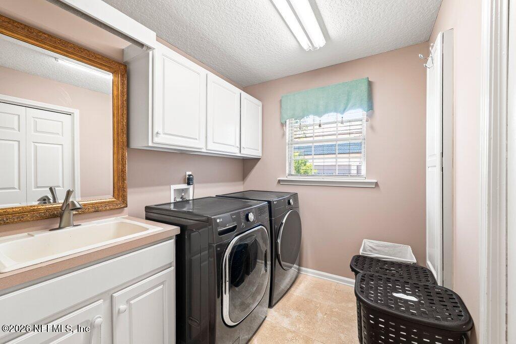 205 Royal Tern Road North Ponte Vedra Beach, FL 32082 - Photo 36 of 85 a utility room with sink dryer and washer