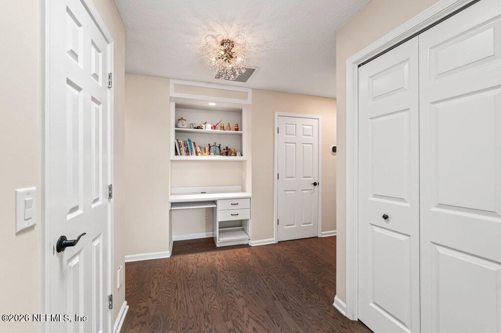 205 Royal Tern Road North Ponte Vedra Beach, FL 32082 - Photo 38 of 85 a view of a hallway with wooden floor and staircase