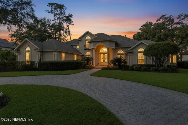 a bathroom with a toilet a sink and shower