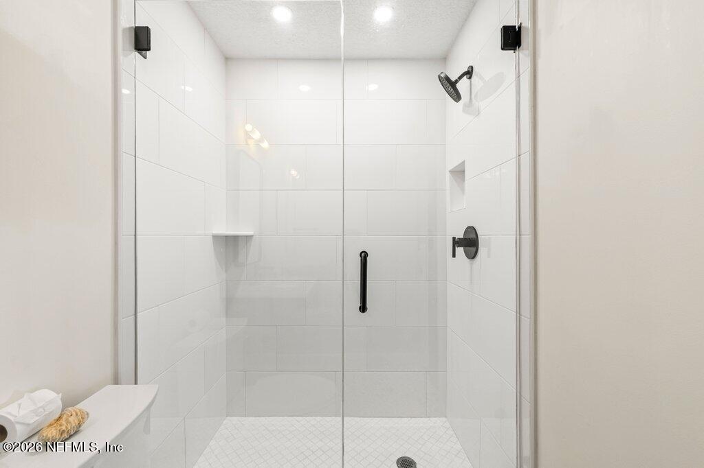205 Royal Tern Road North Ponte Vedra Beach, FL 32082 - Photo 48 of 85 a bathroom with a shower and a toilet