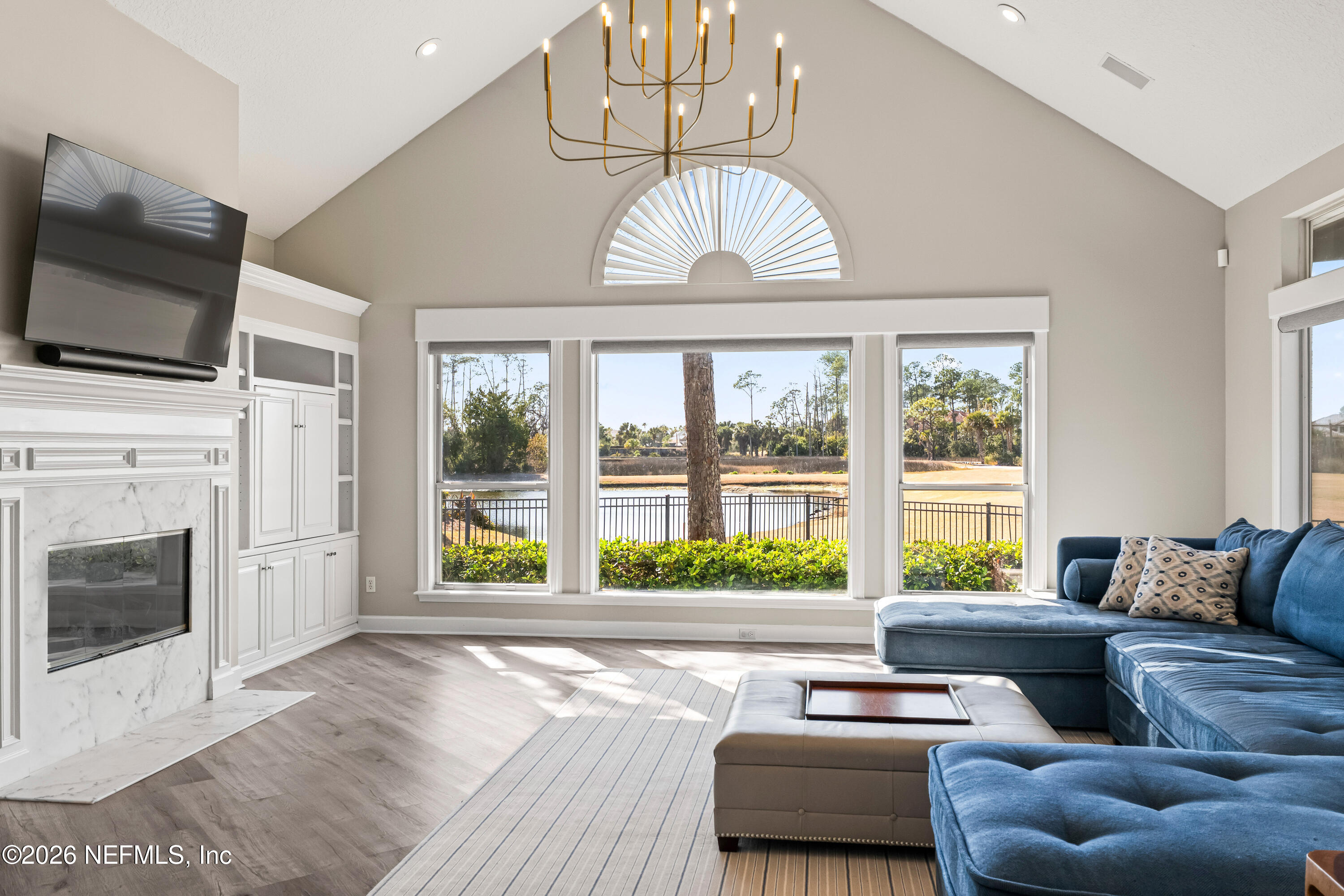 205 Royal Tern Road North Ponte Vedra Beach, FL 32082 - Photo 60 of 85 a living room with furniture a fireplace and a flat screen tv