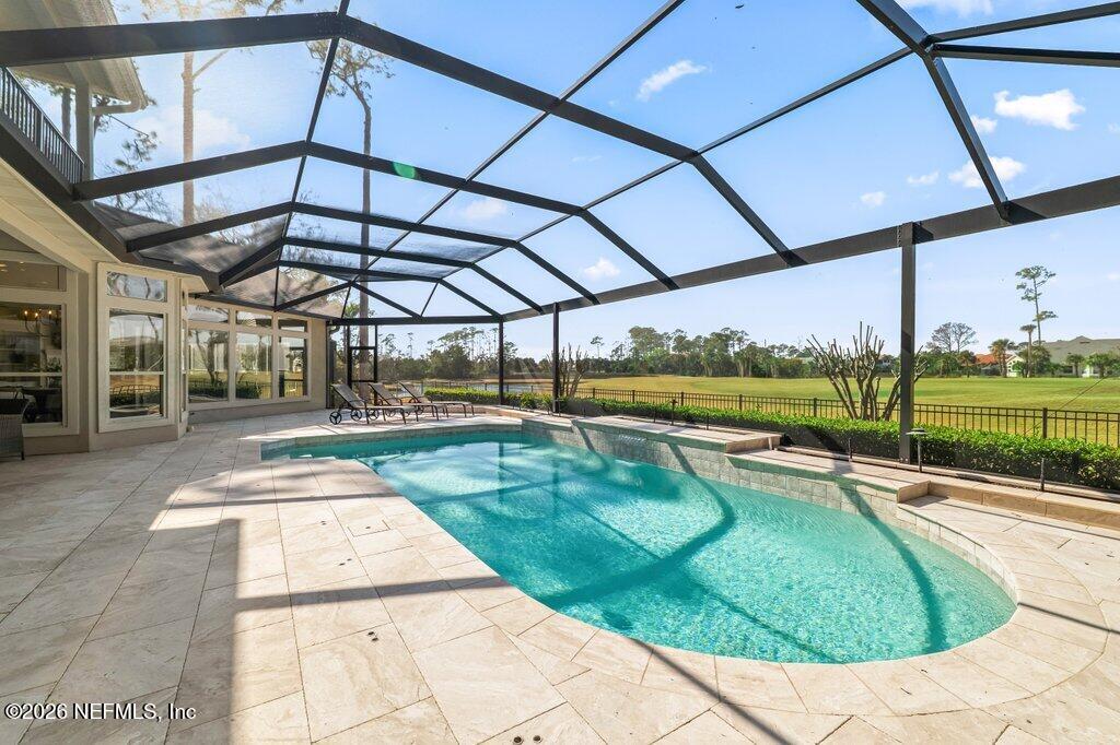 205 Royal Tern Road North Ponte Vedra Beach, FL 32082 - Photo 71 of 85 a view of a swimming pool with a porch