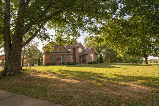 a front view of a house with a yard