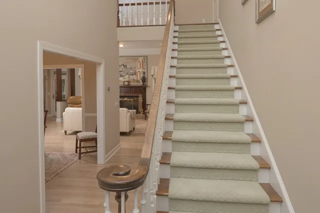 a kitchen with kitchen island granite countertop a sink appliances cabinets and a counter top space