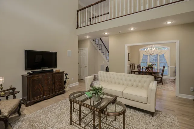 a living room with furniture granite countertop and a fireplace