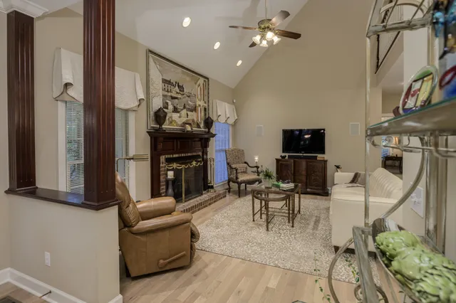 a spacious bathroom with a granite countertop sink a toilet and shower