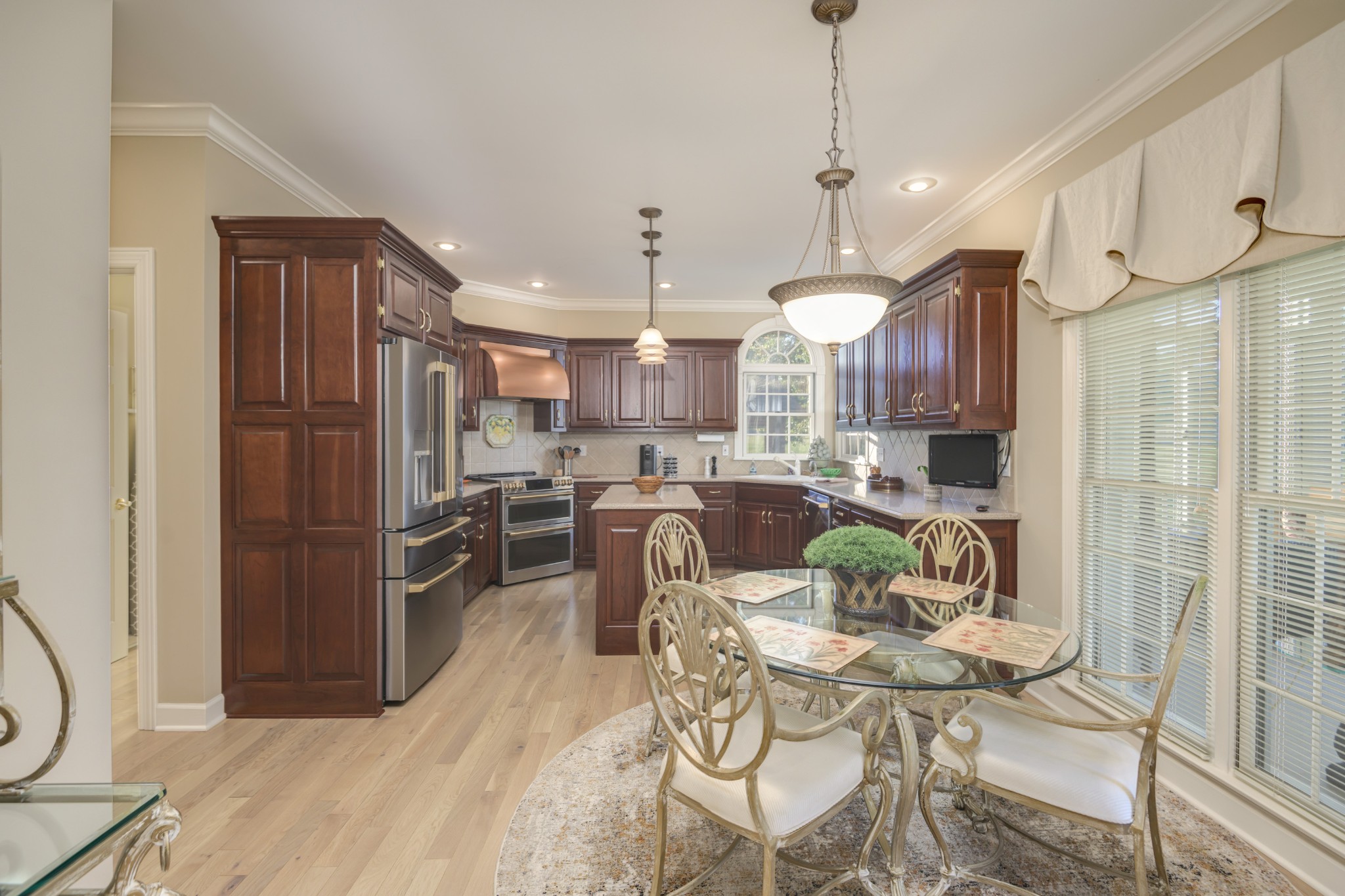 162 W Road Wartrace, TN 37183 - Photo 39 of 96 a view of a dining room with furniture a kitchen and chandelier