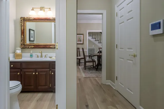 an aerial view of a house with a yard and balcony