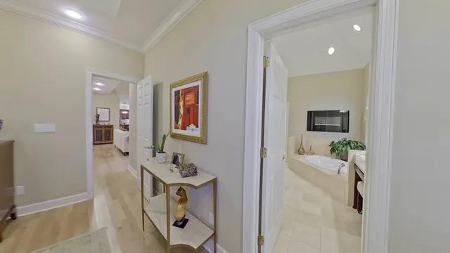 a bathroom with a granite countertop sink a large mirror and a bathtub