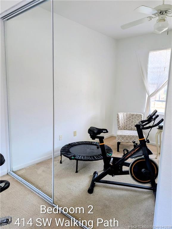 414 Southwest Walking Path, Unit 414 Stuart, FL 34997 - Photo 11 of 15 a room with gym equipment