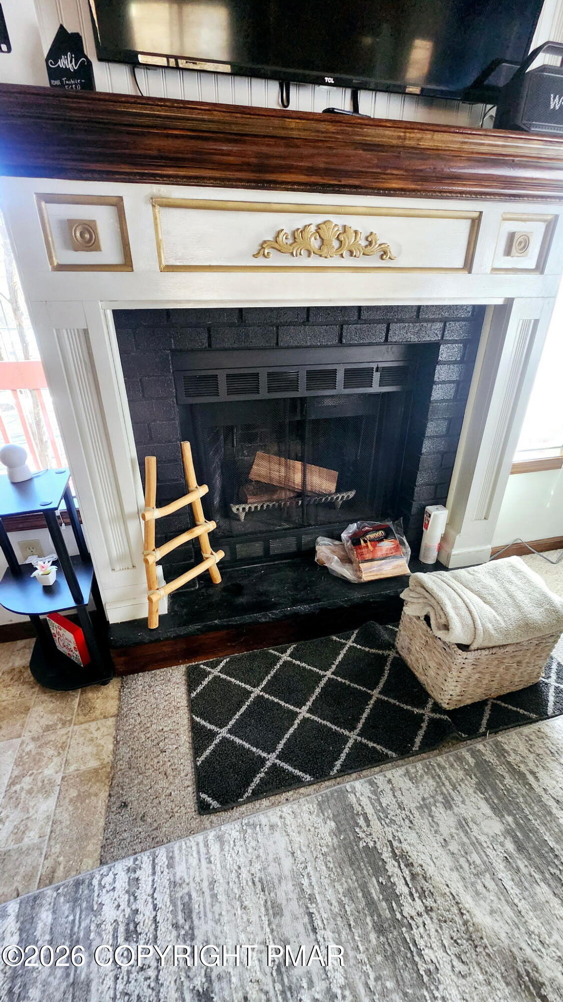 5709 Decker Road Bushkill, PA 18324 - Photo 5 of 32 a living room with furniture and a fireplace