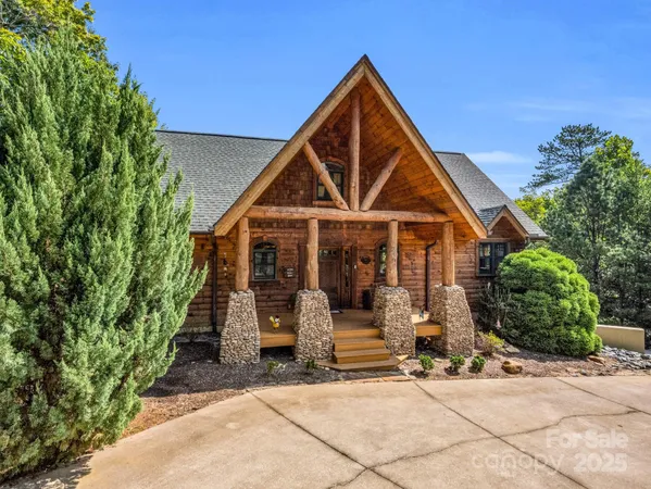 a view of house with wooden fence