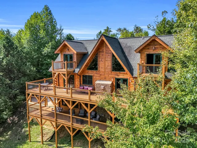 a view of a house with wooden fence