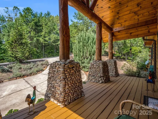 a view of balcony with wooden floor and fence