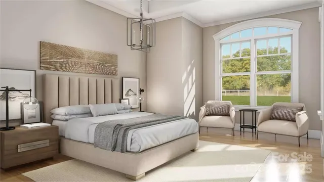 a bedroom with a bed couches and large windows