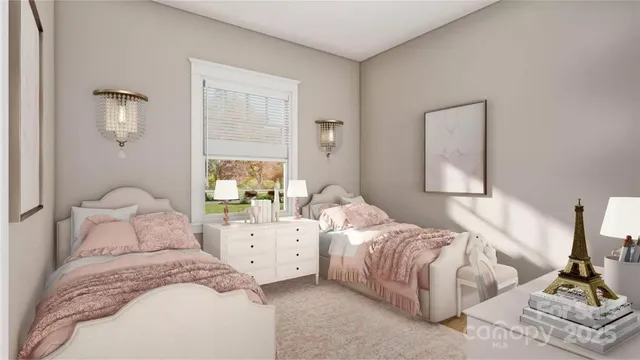 a bedroom with two beds and a window