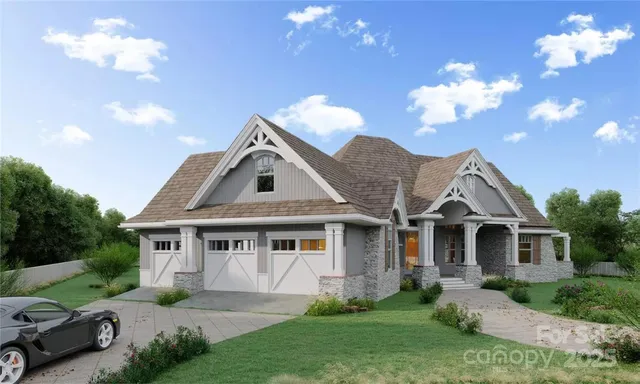 a front view of a house with a yard and a garden