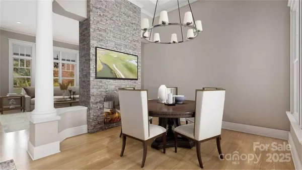 a dining room with furniture and chandelier