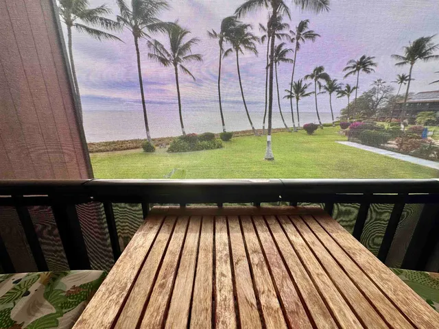 a view of a balcony with furniture