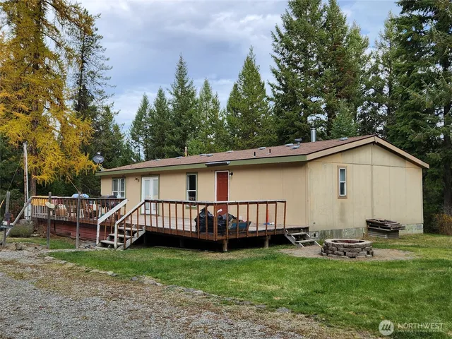 a view of a backyard with a garden and plants