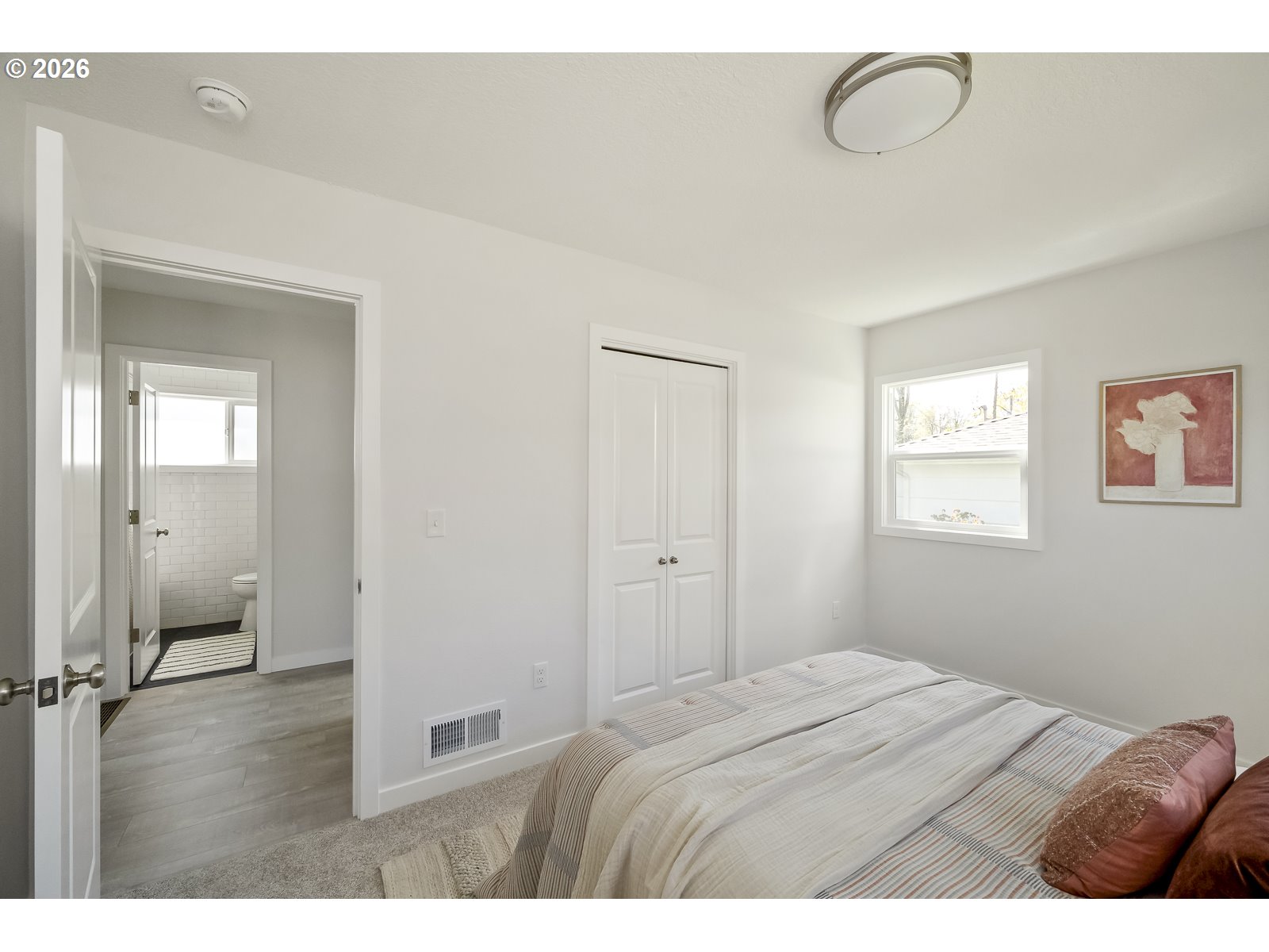 4750 Southwest Larch Drive Beaverton, OR 97005 - Photo 14 of 48 a bedroom with a bed and a window