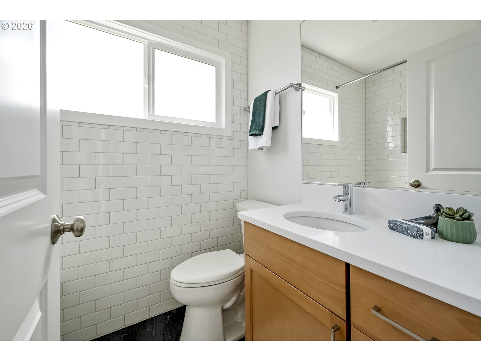 4750 Southwest Larch Drive Beaverton, OR 97005 - Photo 17 of 48 a bathroom with a granite countertop sink a toilet and a mirror