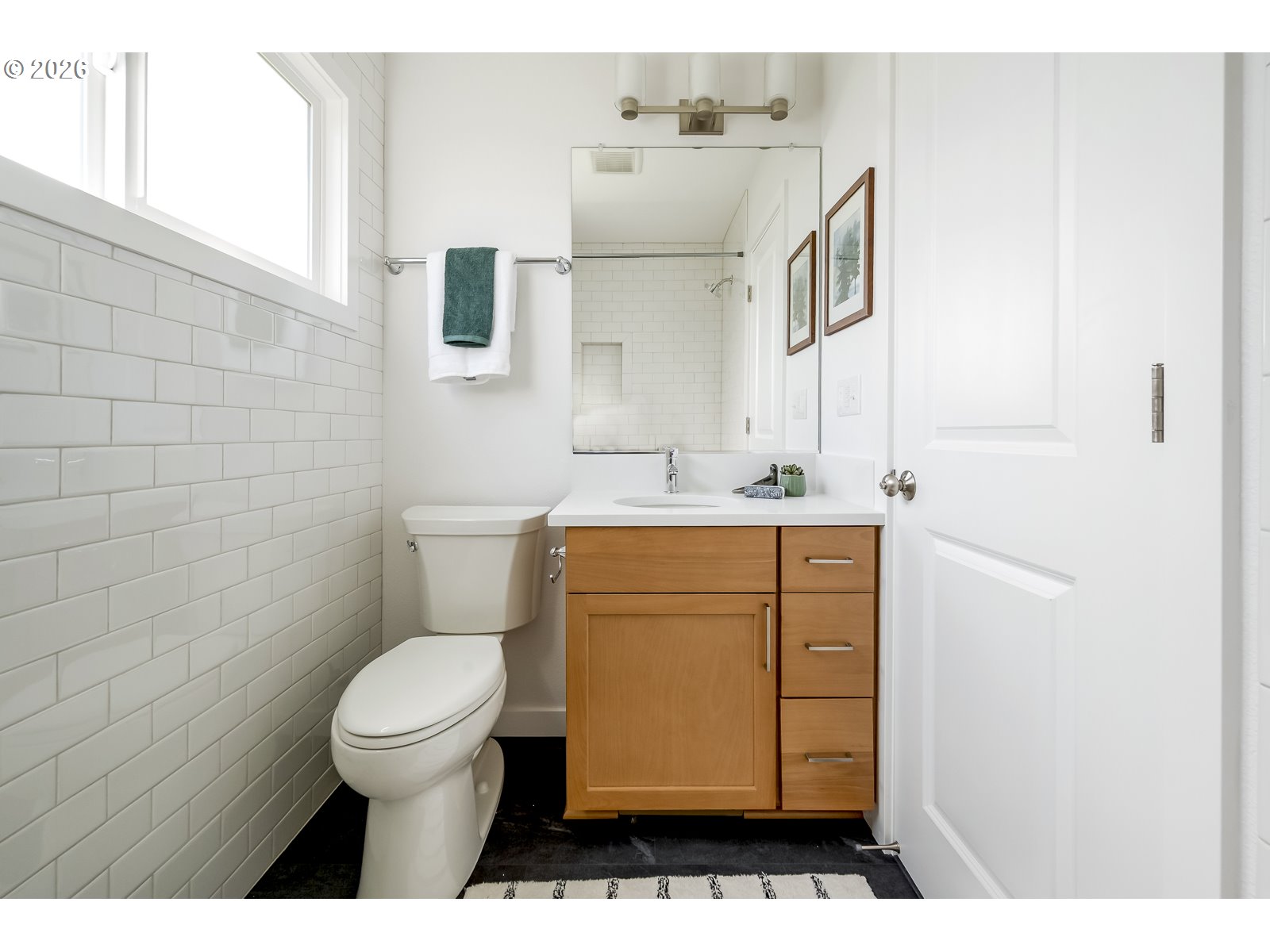 4750 Southwest Larch Drive Beaverton, OR 97005 - Photo 19 of 48 a bathroom with a sink a toilet and mirror