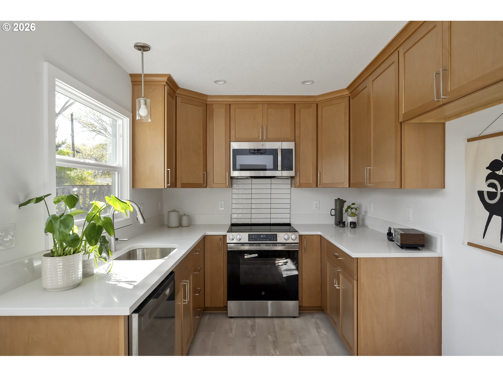 4750 Southwest Larch Drive Beaverton, OR 97005 - Photo 24 of 48 a kitchen with a sink cabinets and a window