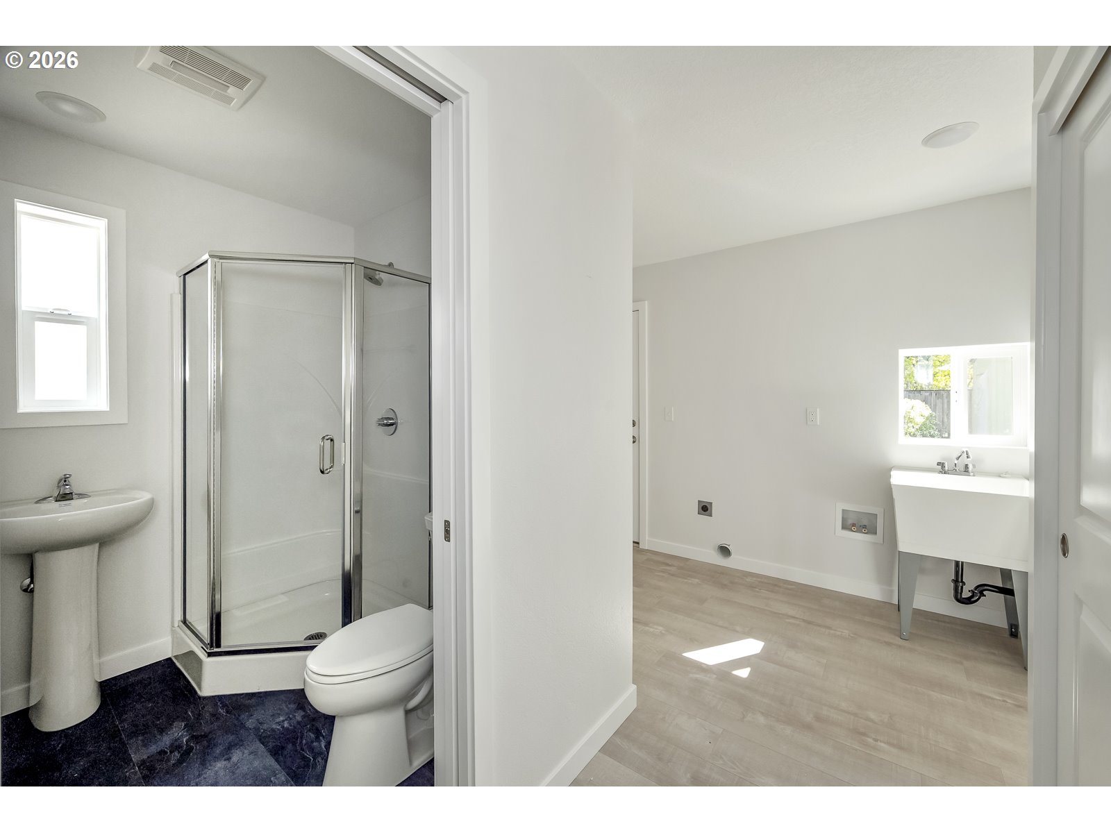 4750 Southwest Larch Drive Beaverton, OR 97005 - Photo 31 of 48 a bathroom with a toilet a sink and a window