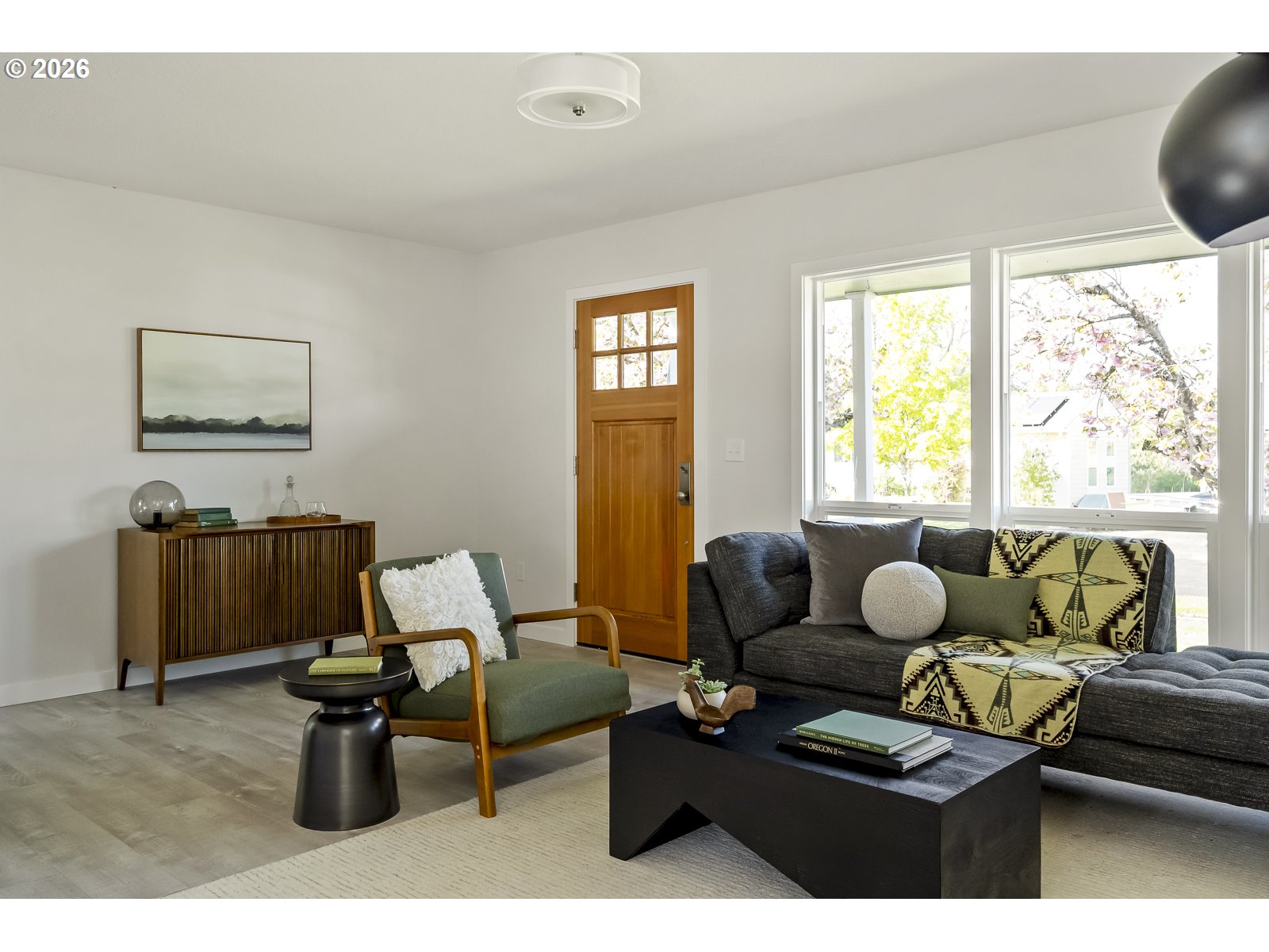 4750 Southwest Larch Drive Beaverton, OR 97005 - Photo 7 of 48 a living room with furniture and a large window