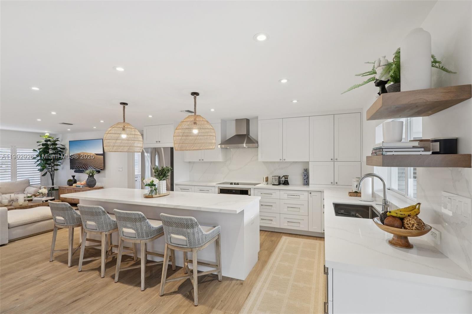 2105 Southwest 98th Avenue Miami, FL 33165 - Photo 1 of 88 a kitchen with stainless steel appliances kitchen island granite countertop a dining table chairs sink and white cabinets