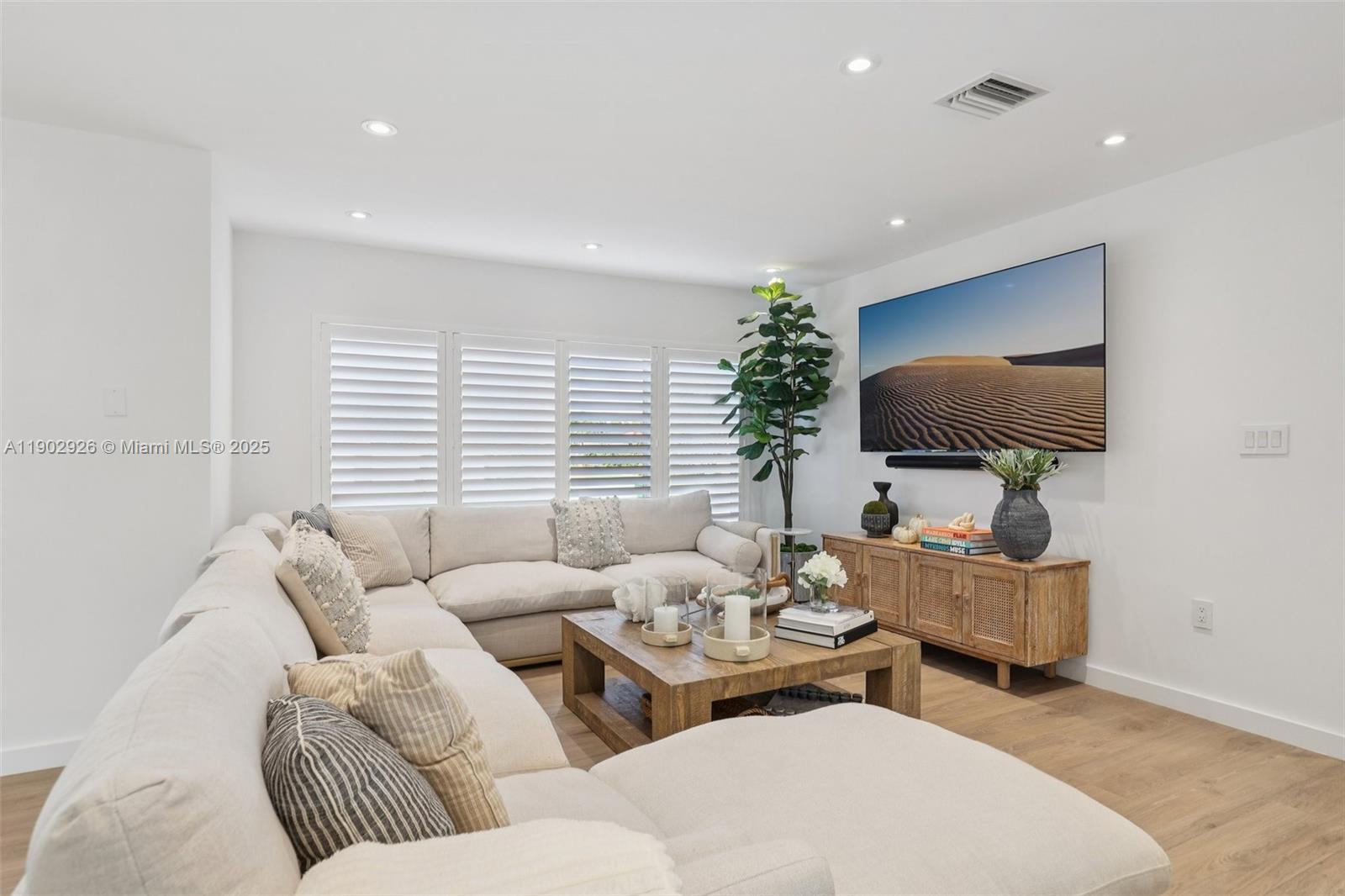 2105 Southwest 98th Avenue Miami, FL 33165 - Photo 11 of 88 a living room with furniture and a flat screen tv