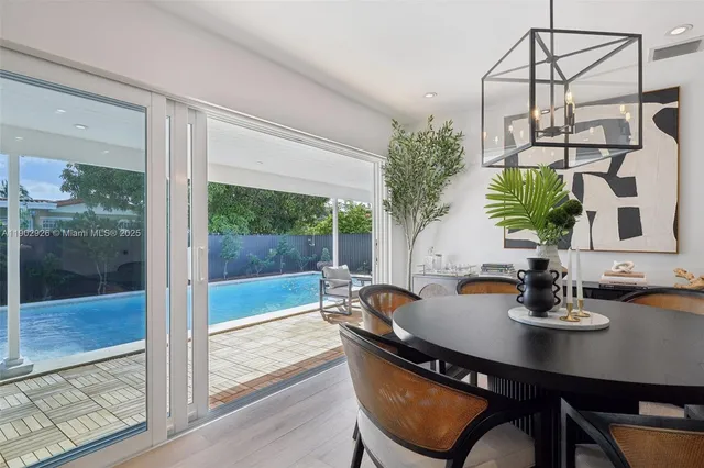 a white toilet sitting next to a white sink
