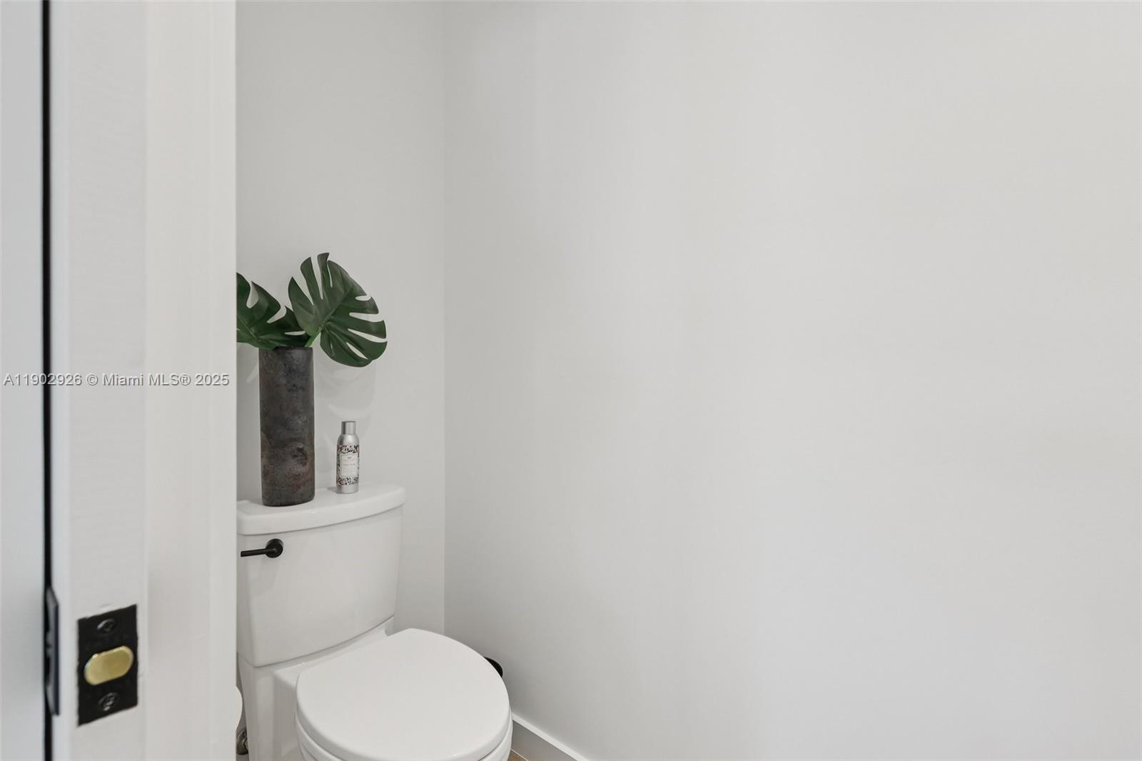 2105 Southwest 98th Avenue Miami, FL 33165 - Photo 19 of 88 a white toilet sitting next to a white sink