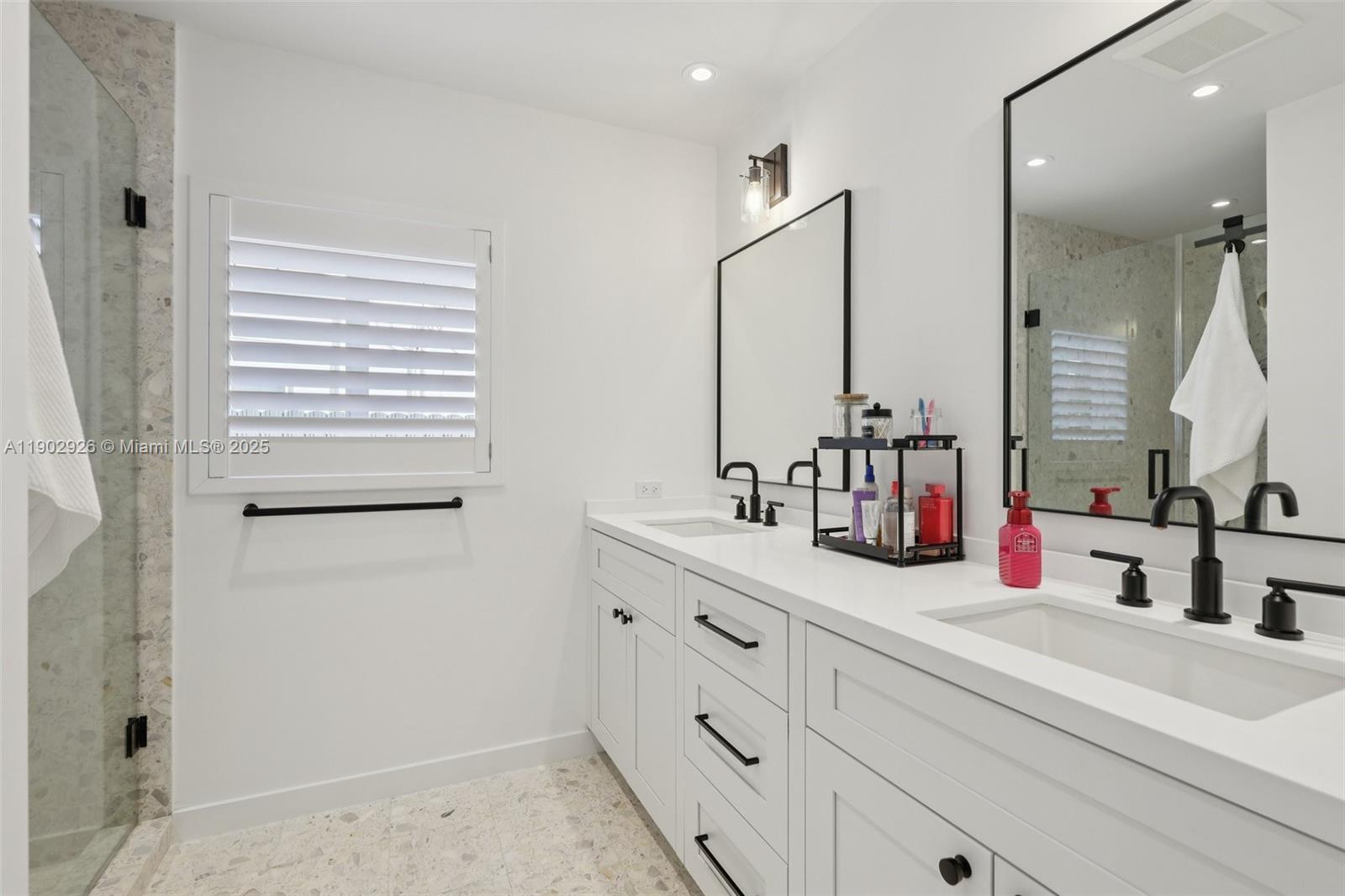 2105 Southwest 98th Avenue Miami, FL 33165 - Photo 28 of 88 a bathroom with a sink and a mirror