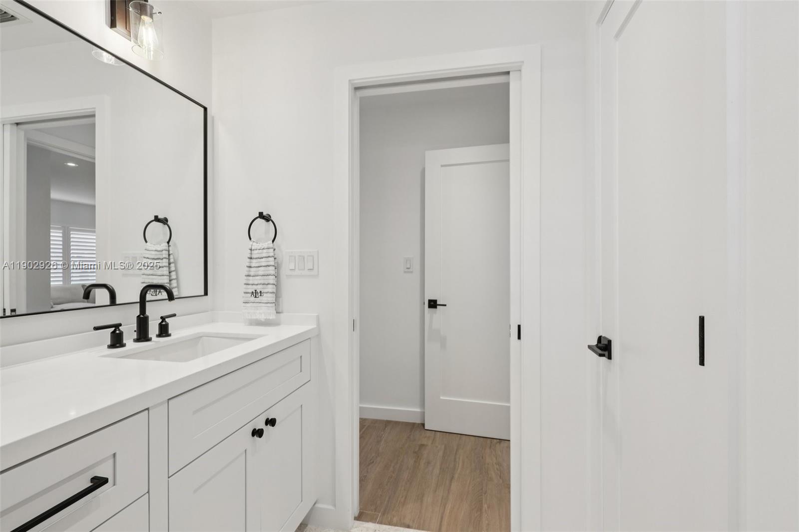 2105 Southwest 98th Avenue Miami, FL 33165 - Photo 30 of 88 a bathroom with a sink and a mirror