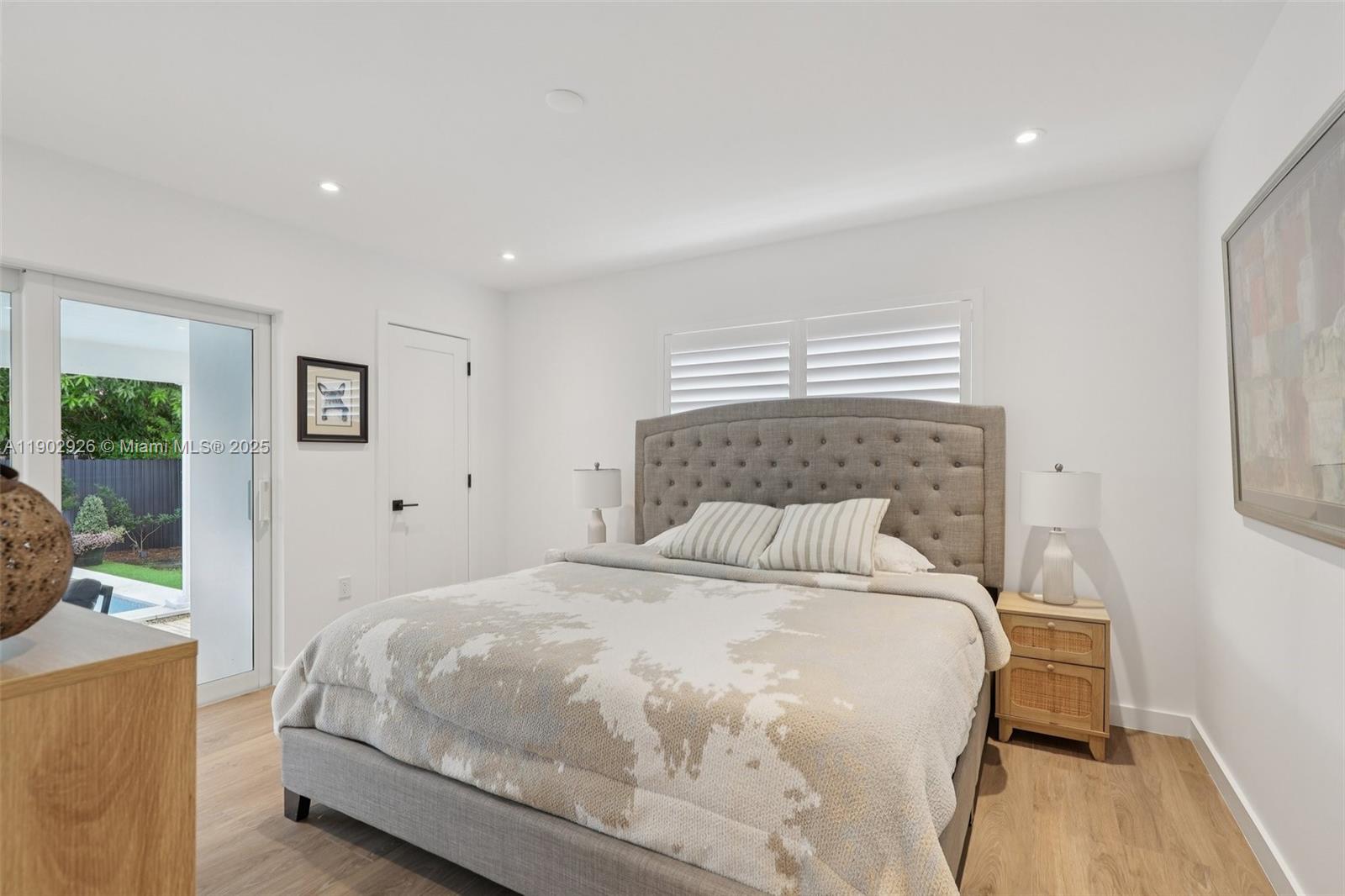 2105 Southwest 98th Avenue Miami, FL 33165 - Photo 34 of 88 a bedroom with a large bed and a window