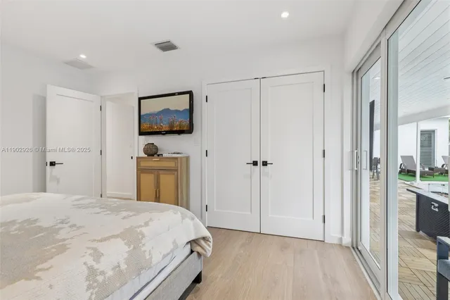 a view of a house with swimming pool and porch