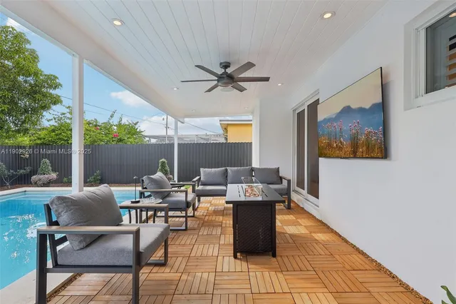 a view of a backyard with sitting area