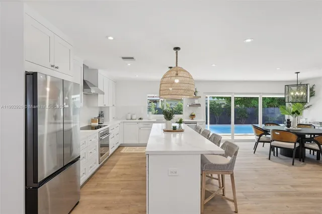 a living room with furniture potted plant and a window